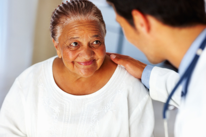 Smiling woman speaking with doctor