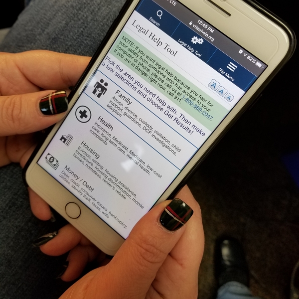 Someone using the Legal Help Tool on their phone